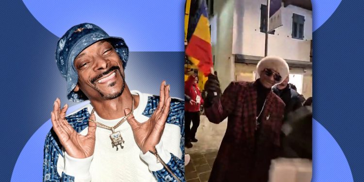 celebrul-artist-snoop-dogg,-filmat-in-timp-de-flutura-un-steag-al-romaniei-la-jocurile-olimpice-de-iarna-de-la-milano-cortina