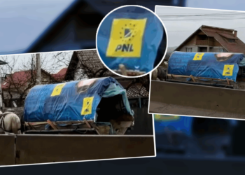 imaginile-zilei-surprinse-pe-un-drum-national.-o-caruta-acoperita-de-un-banner-electoral-pnl-se-taraie-prin-ploaie